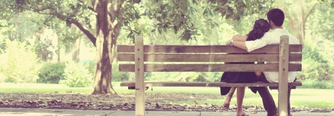 couple on bench under tree