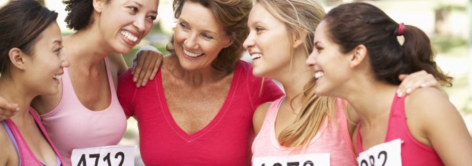 women huddling at a marathon