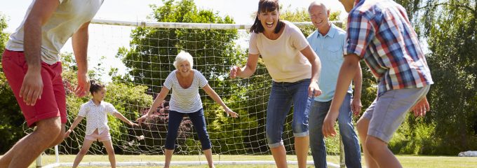 family playing soccer