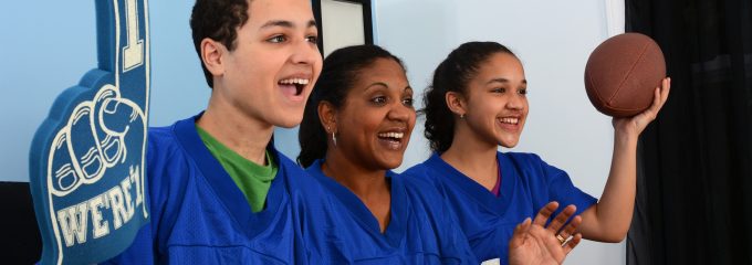 family cheering at the game