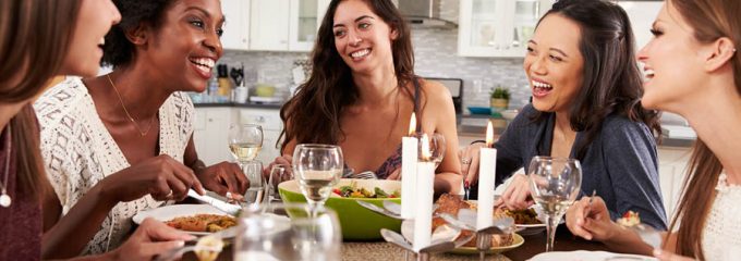 Friends eating dinner together